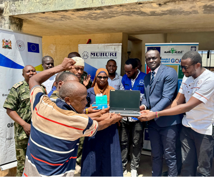 NLAS staff donating laptops to marginalized persons in prison to enable them attend virtual court sessions
